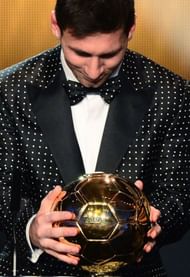 Barcelona's Lionel Messi holds his trophy in Zurich on January 7, 2013